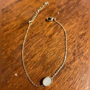 Dainty gold bracelet with Opal coloured stone!